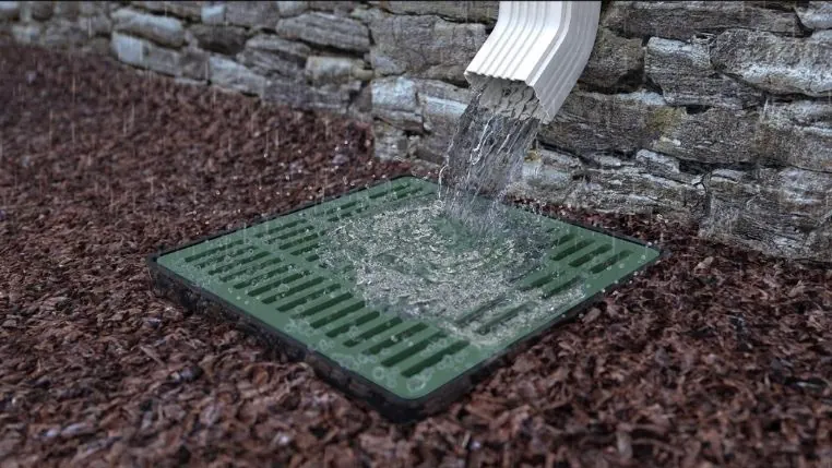 Downspout drainage catch basin with water flowing - Stormwater Management Freeport FL
