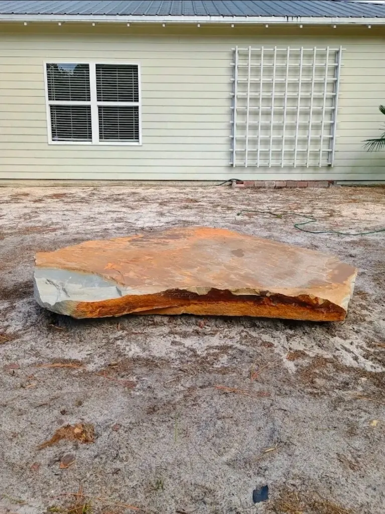 Large natural stone boulder placed as landscape focal point