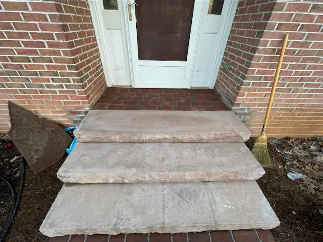 Natural stone entry steps at brick home - HT Outdoor Living